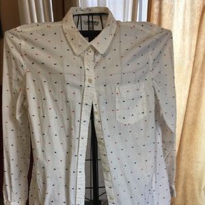White button down shirt with red and blue dots
